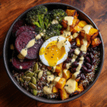 iron-rich quinoa breakfast bowl with roasted vegetables and tahini
